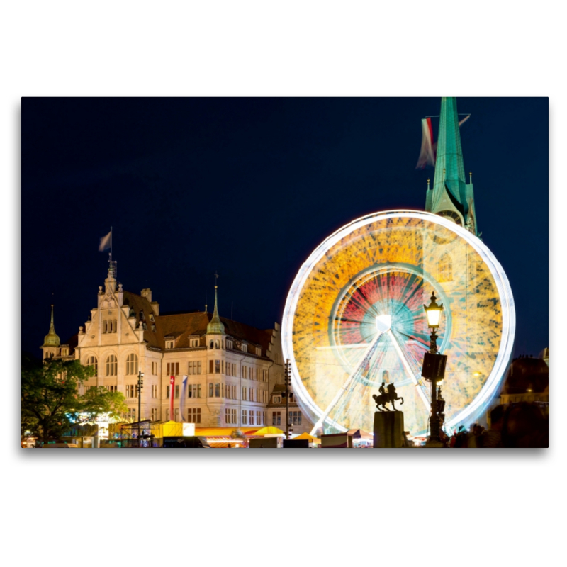 Riesenrad vor historischer Kulisse.