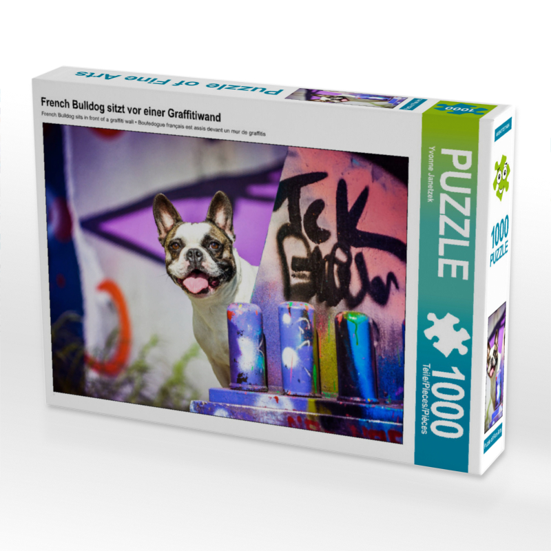 French Bulldog sitzt vor einer Graffitiwand