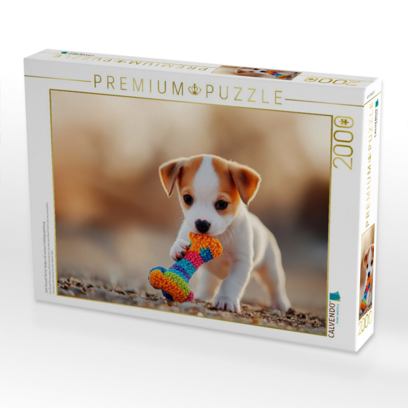 Jack Russell Terrier Welpe mit seinem Lieblingsspielzeug