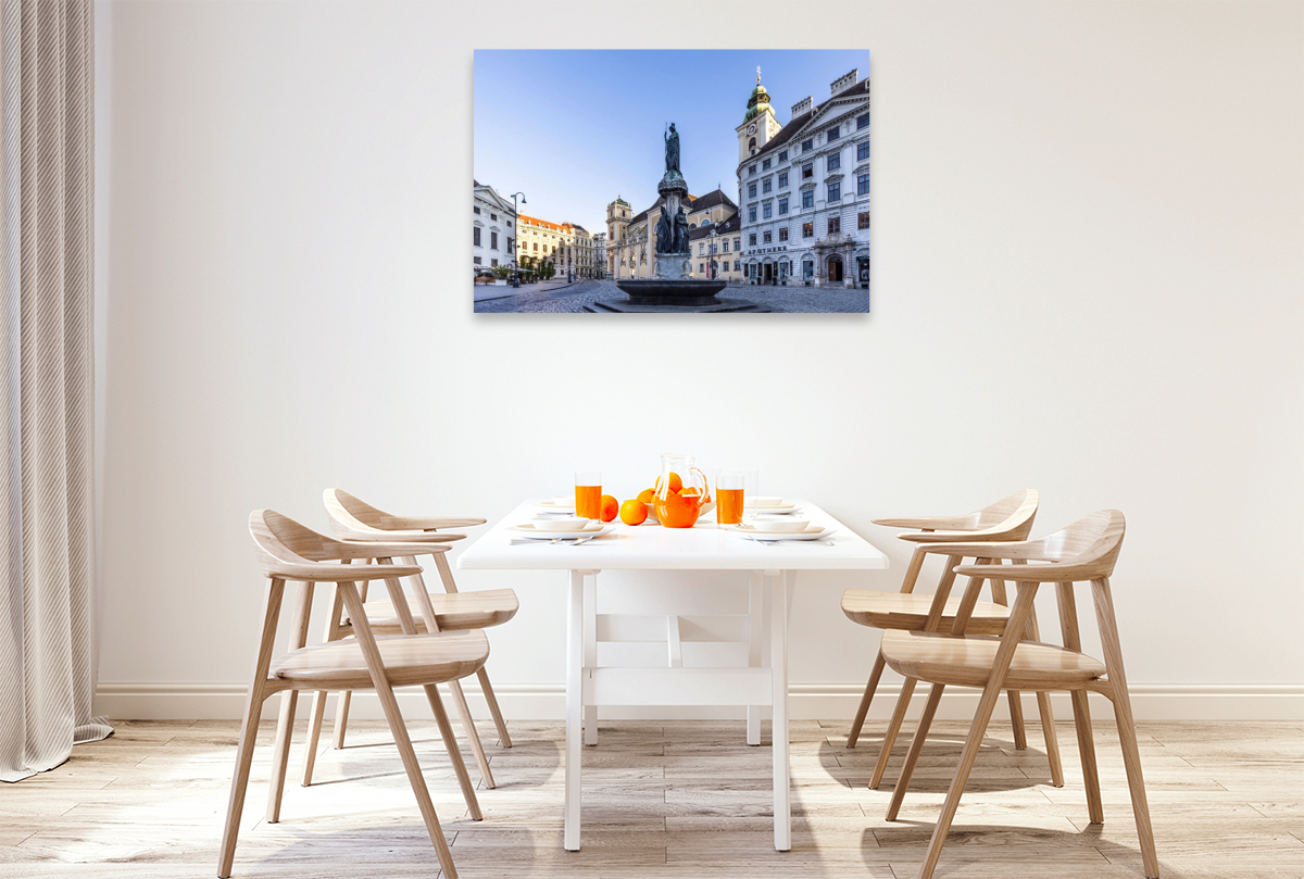Austriabrunnen und Schottenkirche auf dem Platz Freyung in Wien