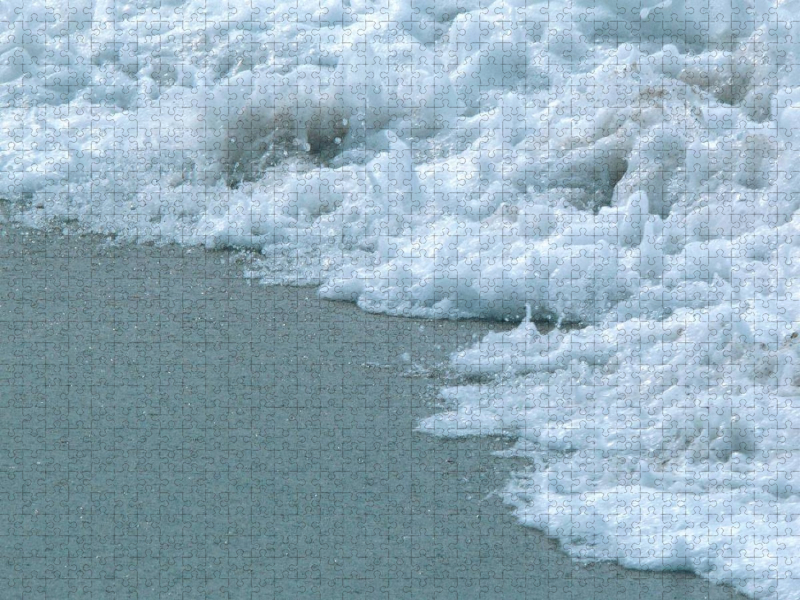 Die Gischt am Strand